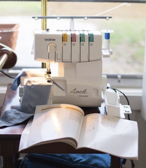 a sewing machine sitting on top of a table