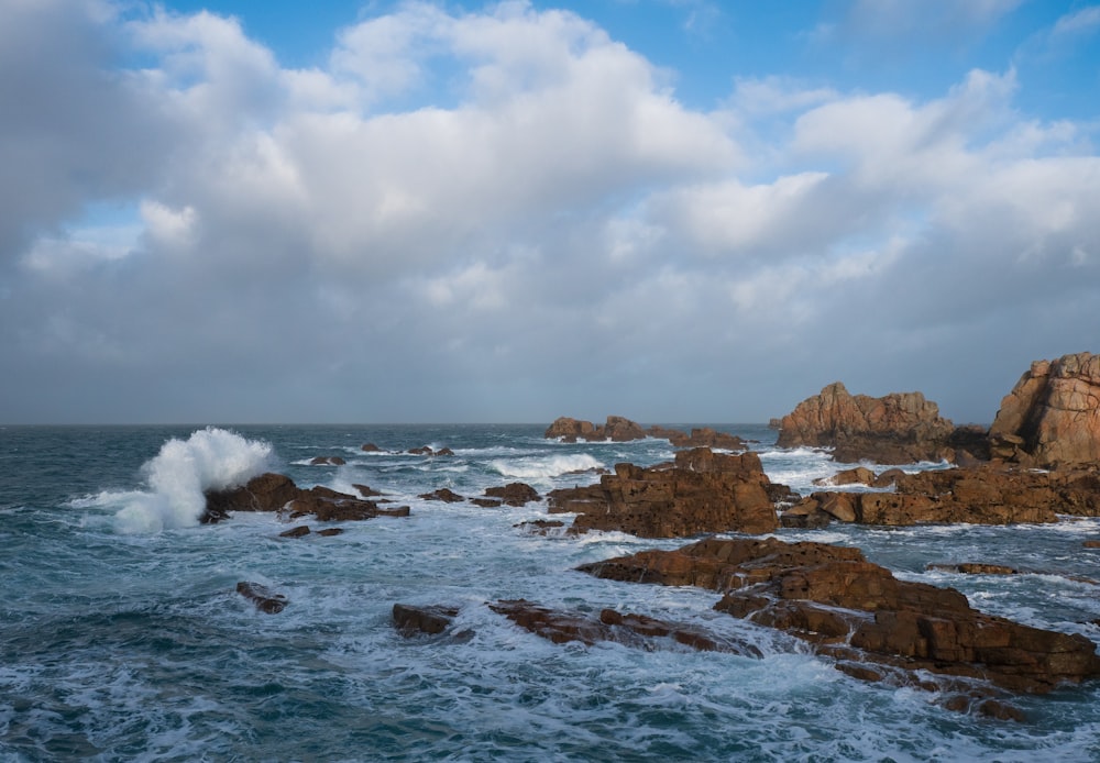 a large body of water surrounded by rocks