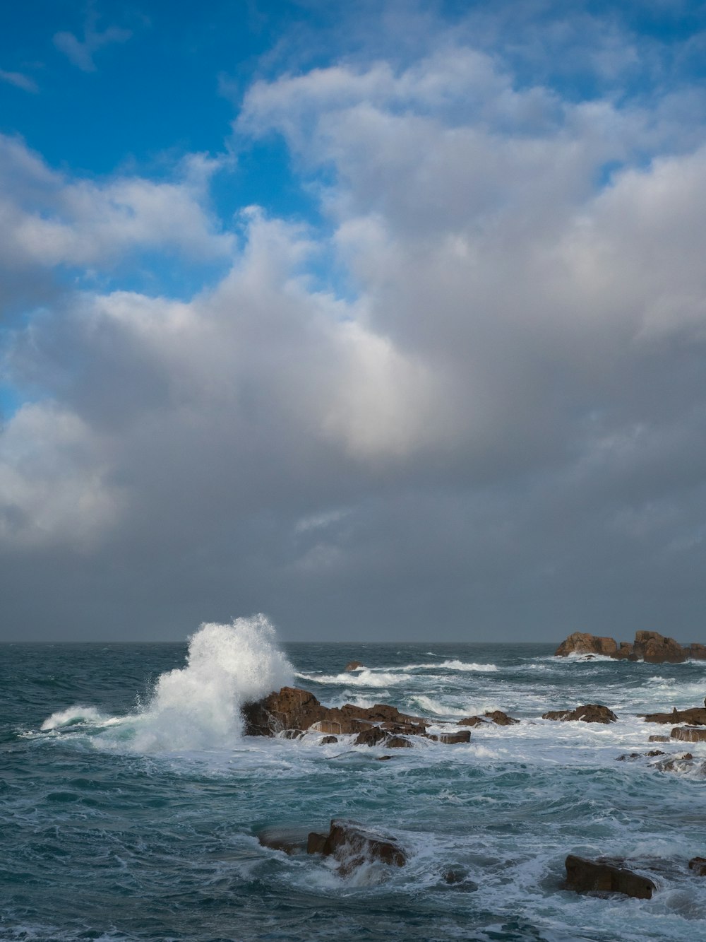 a large body of water surrounded by rocks