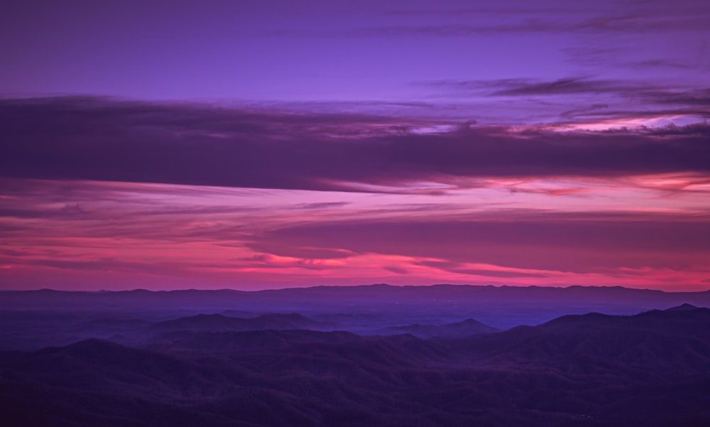 a view of a mountain range at sunset