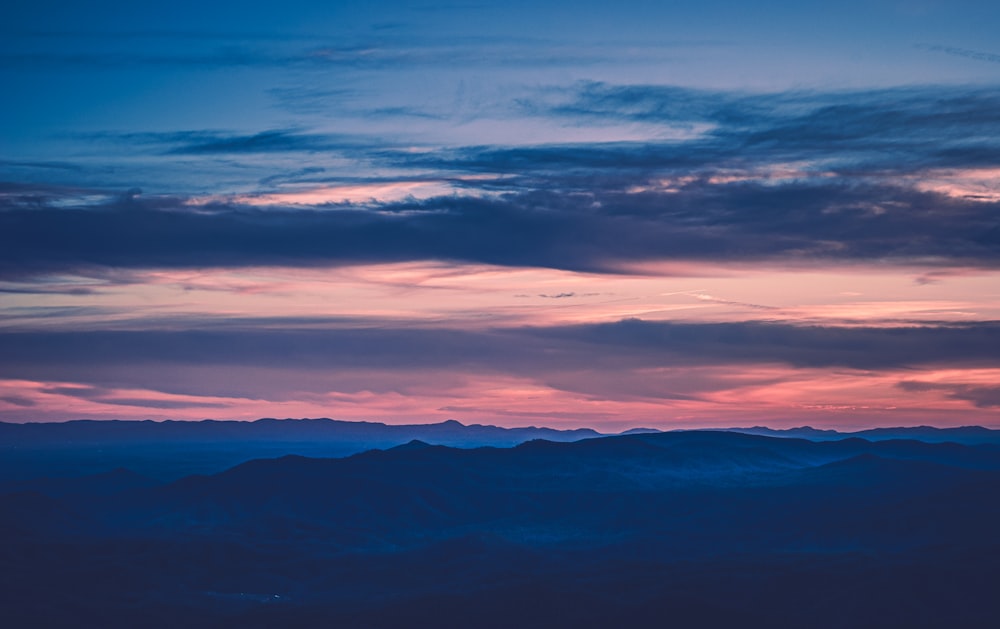 a view of a mountain range at sunset