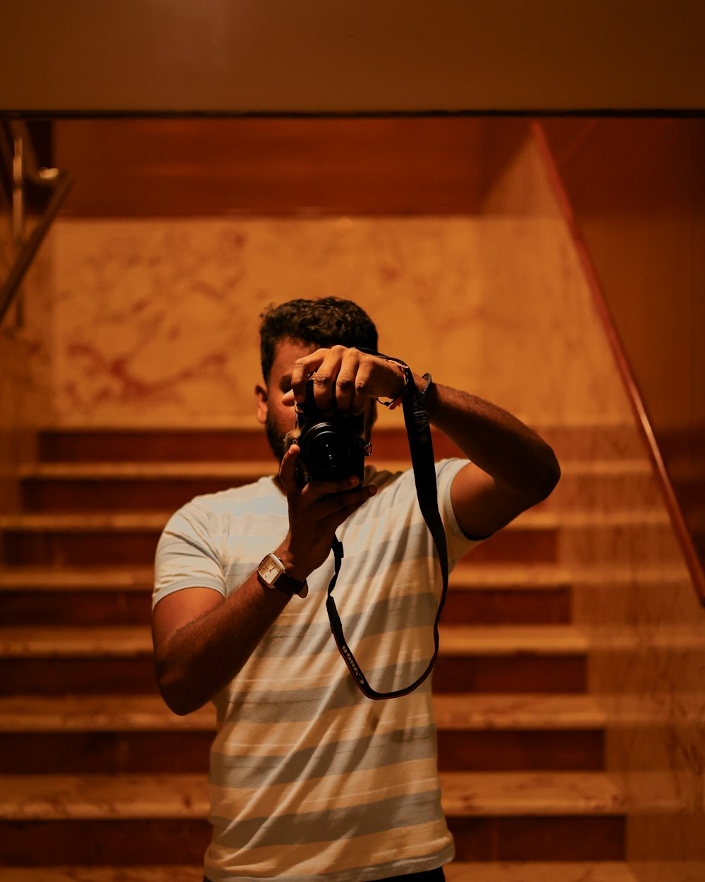 a man taking a picture of himself with a camera