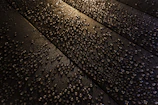 Close-up of the durable, scratch-resistant solar panel surface with water droplets.