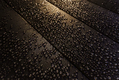 Close-up of the durable, scratch-resistant solar panel surface with water droplets.