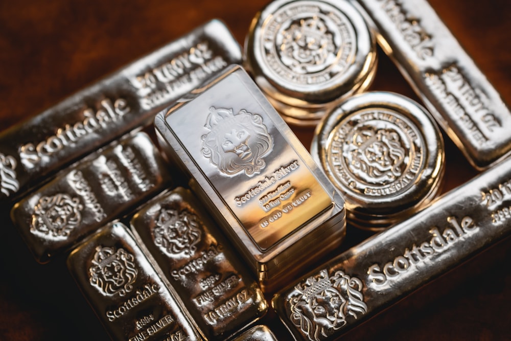 a bunch of silver bars sitting on top of each other