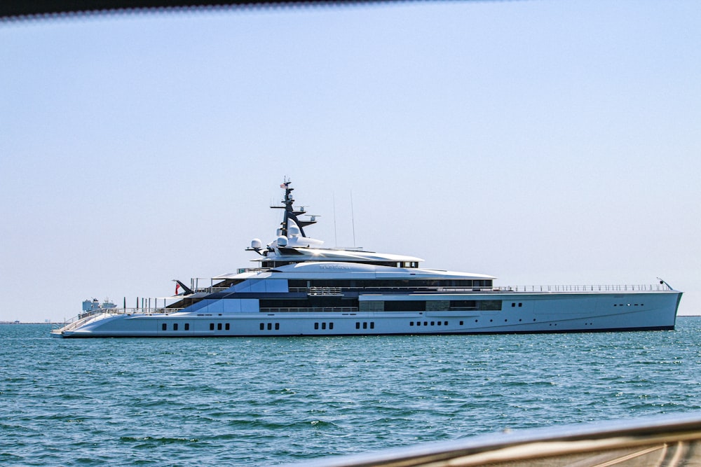 a large white boat floating on top of a body of water