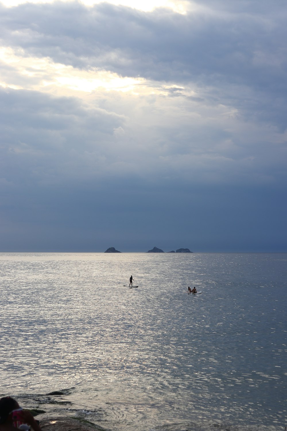 a couple of people are out in the water