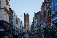 a city street with people walking down it