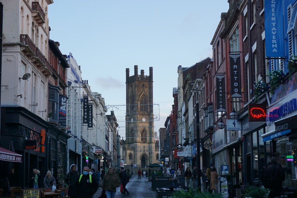 a city street with people walking down it