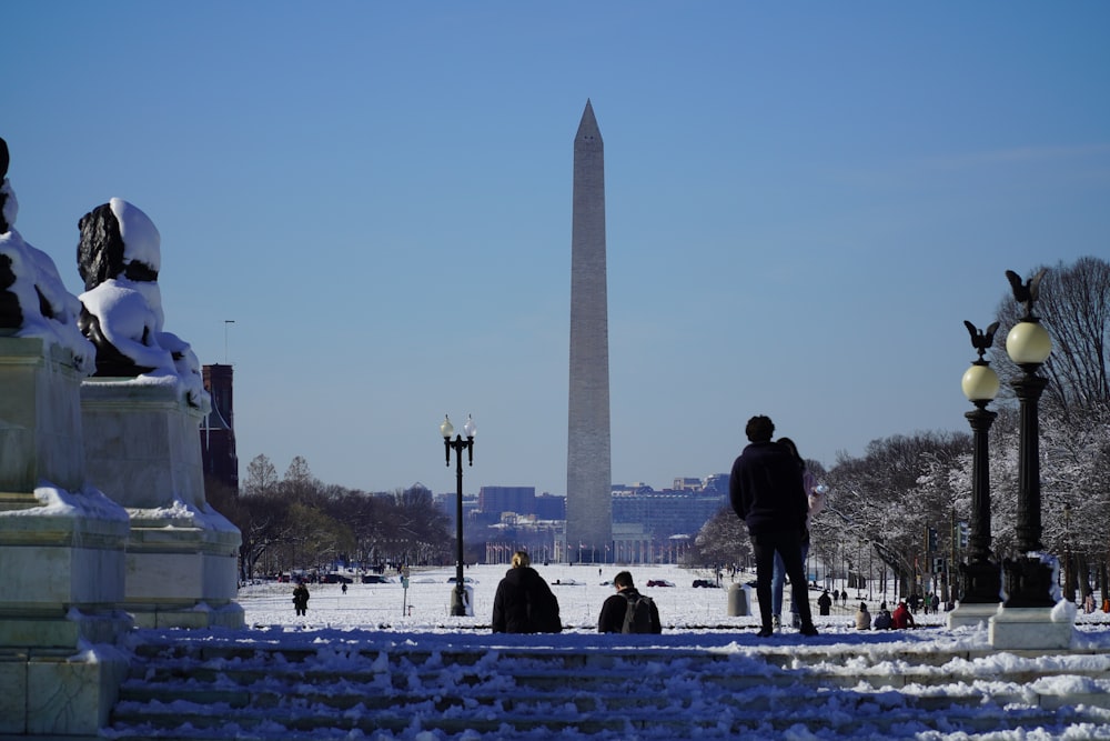 a man standing in front of the washington monument