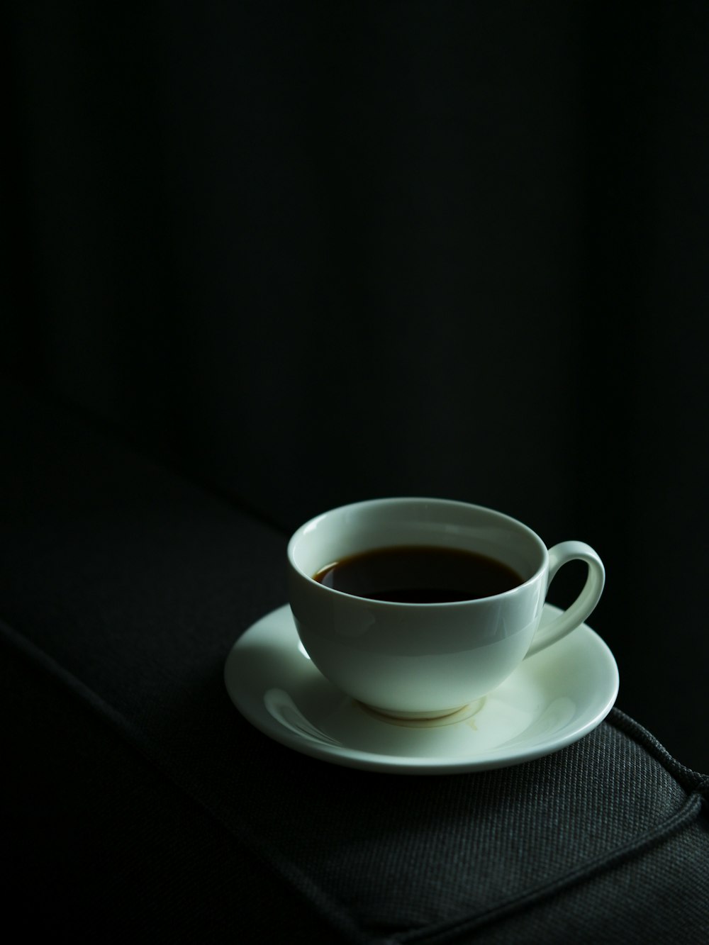 a cup of coffee sitting on top of a saucer