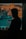 a man looking out a window at a parking lot