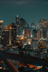 a view of a city at night from the top of a building