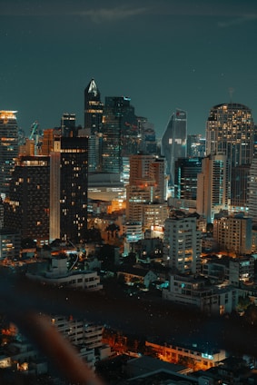 a view of a city at night from the top of a building