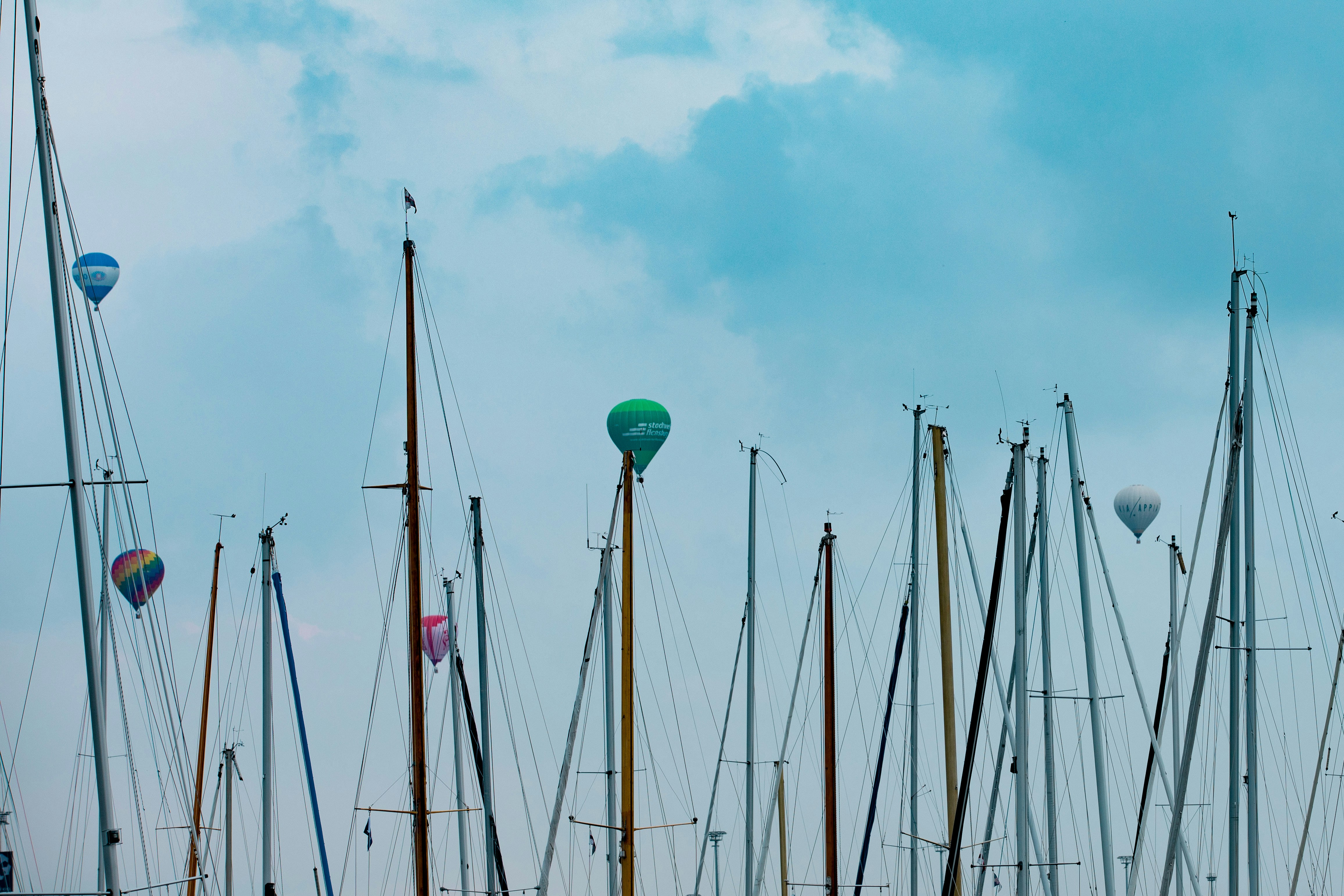 a lot of sailboats that are sitting in the water