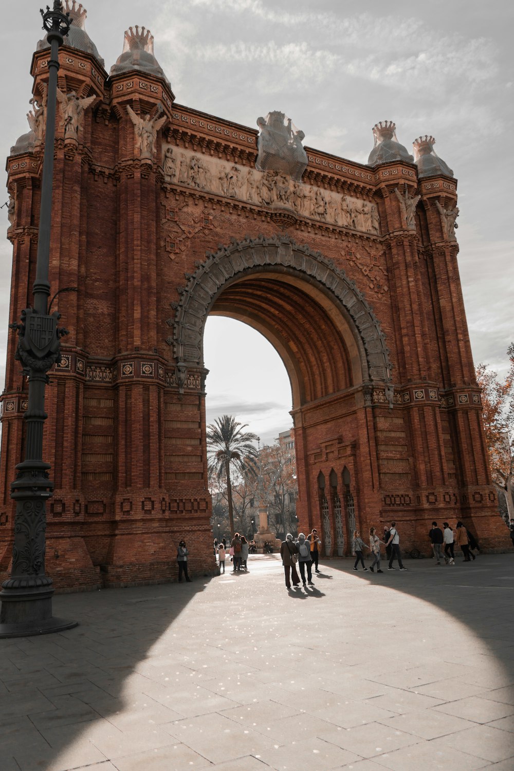 a large brick arch with a clock on the top of it