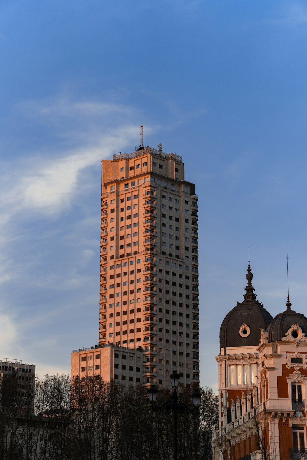 a tall building with a sky background