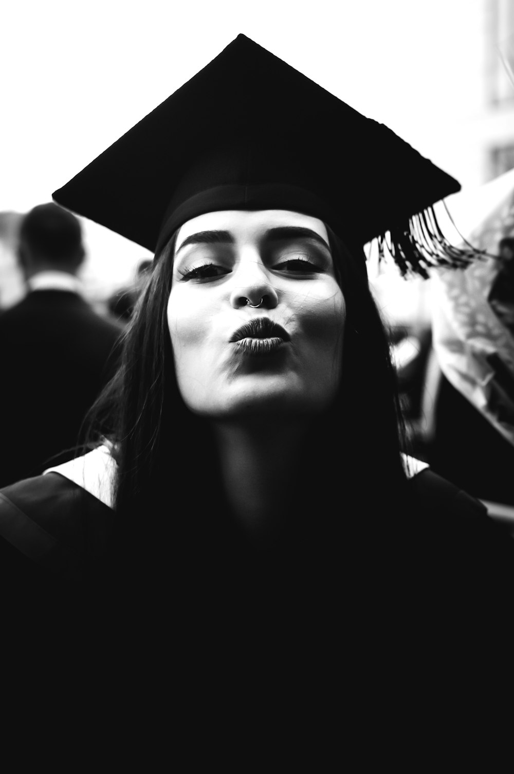 a woman wearing a graduation cap and gown