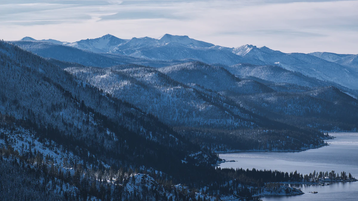 Snowy forested ridges falling to Lake Tahoe in winter, near Incline Village