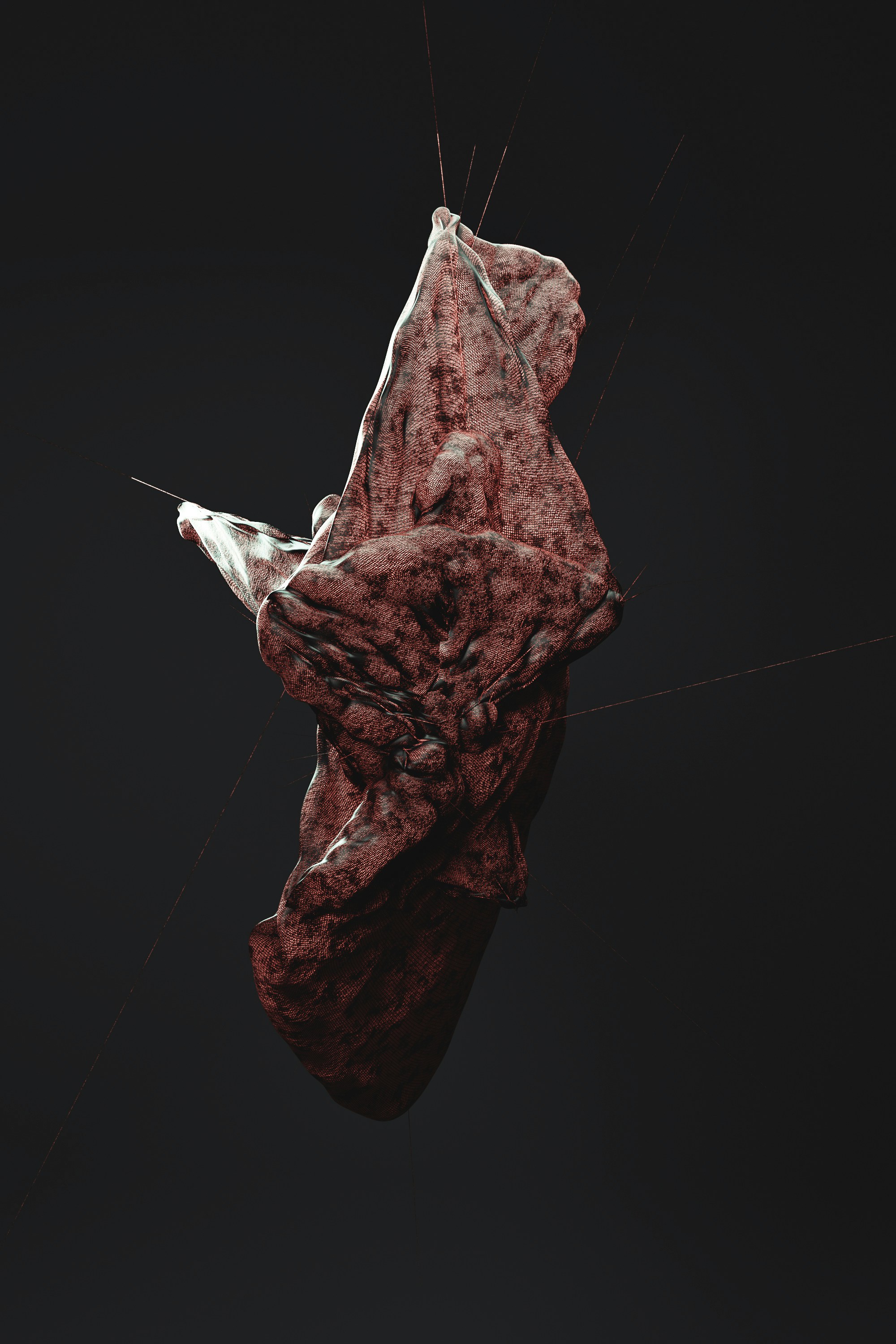 a piece of red material floating in the air