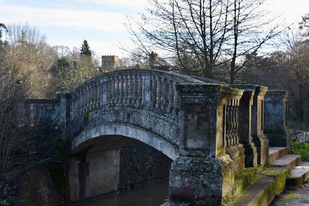 a stone bridge over a body of water