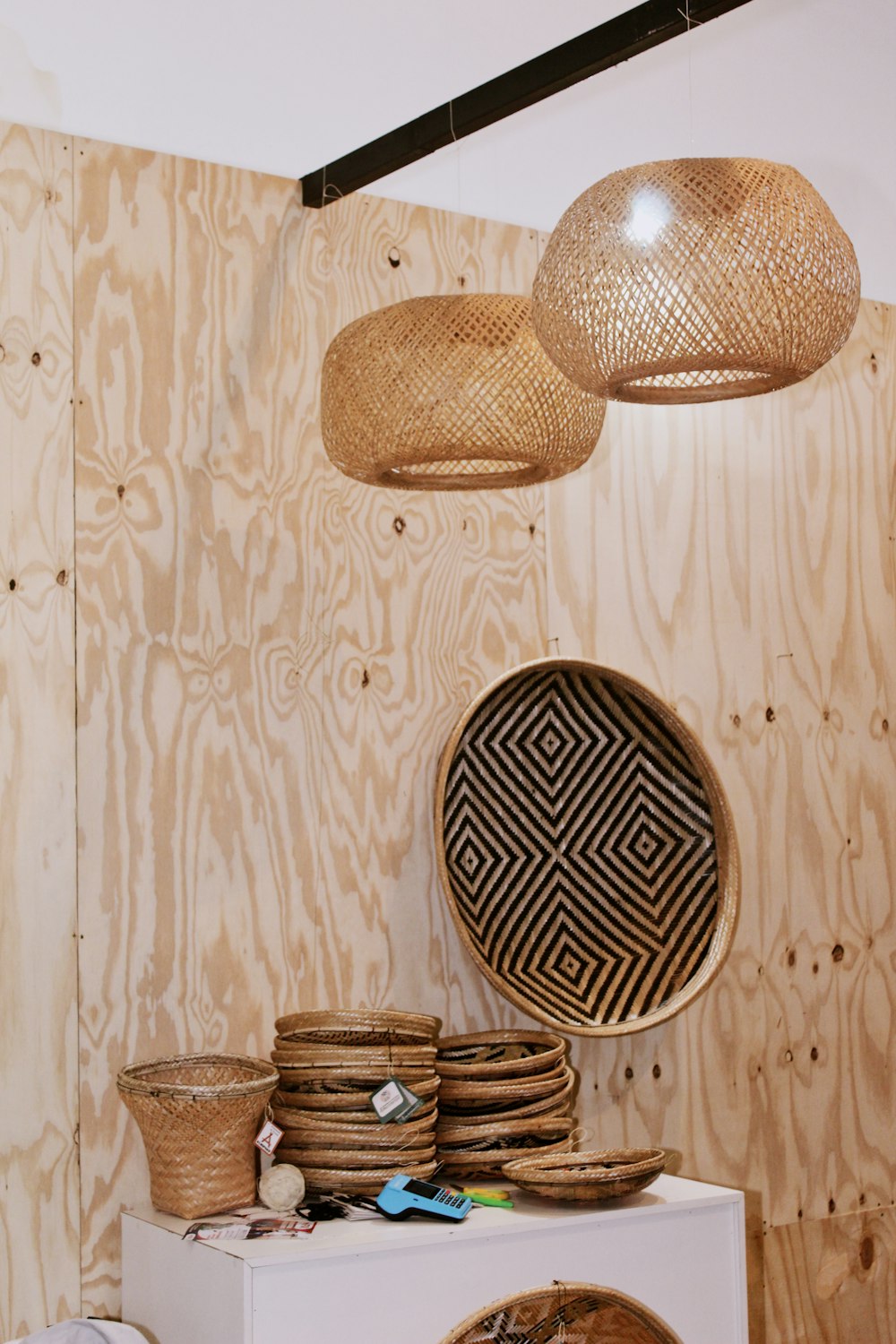 a room with baskets and lights hanging from the ceiling