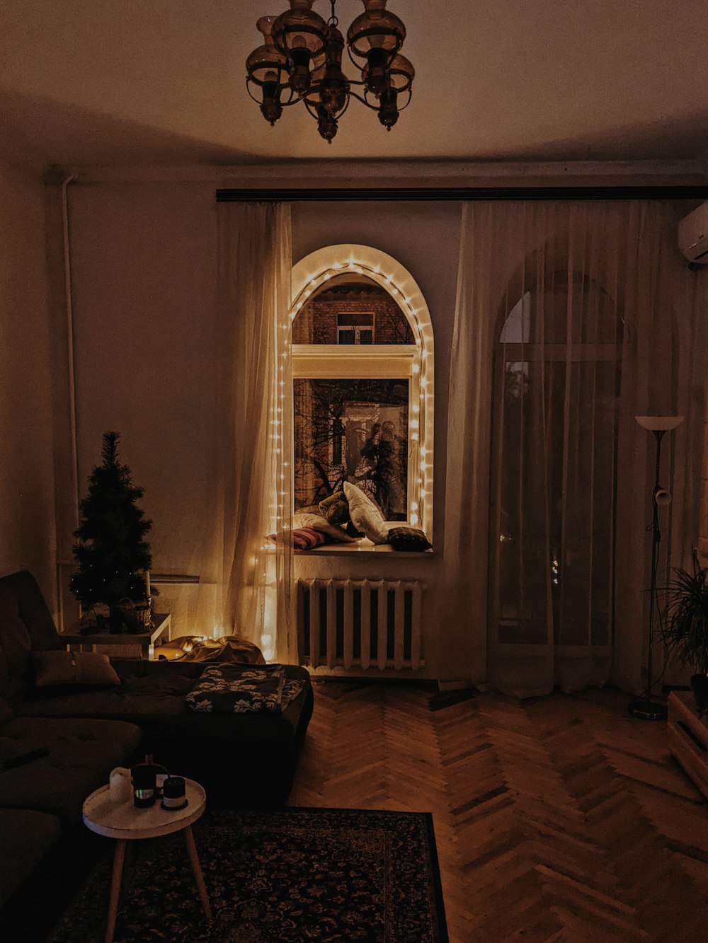 a living room filled with furniture and a window