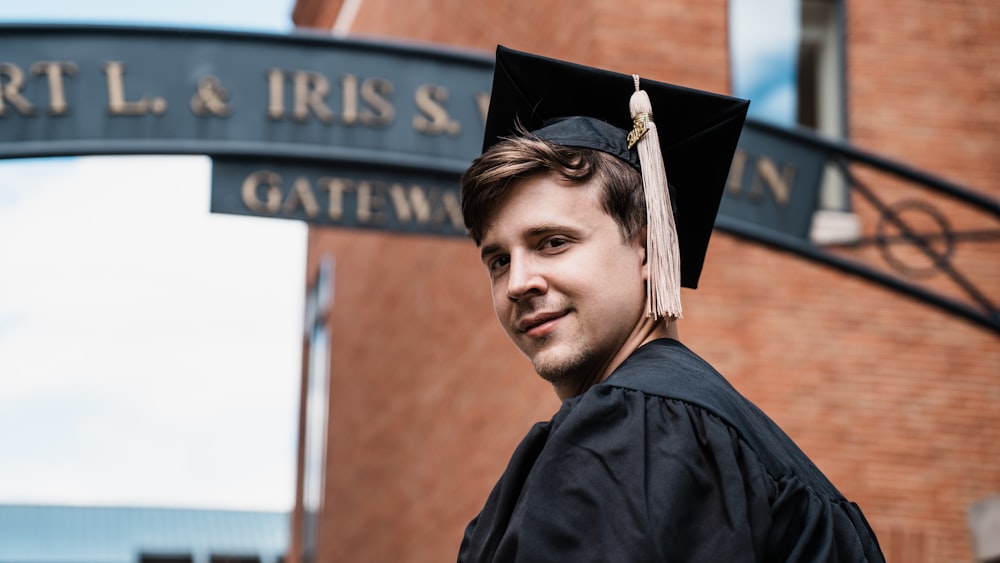 a man in a graduation cap and gown