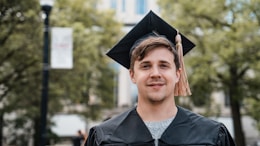 a man in a graduation cap and gown