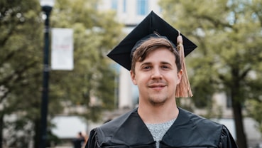 a man in a graduation cap and gown