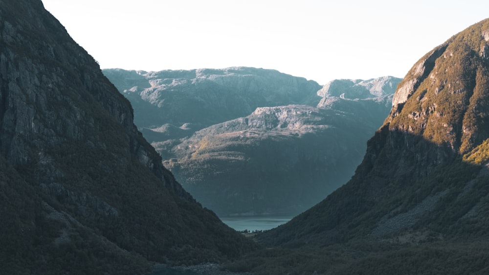 a view of a valley with mountains in the background