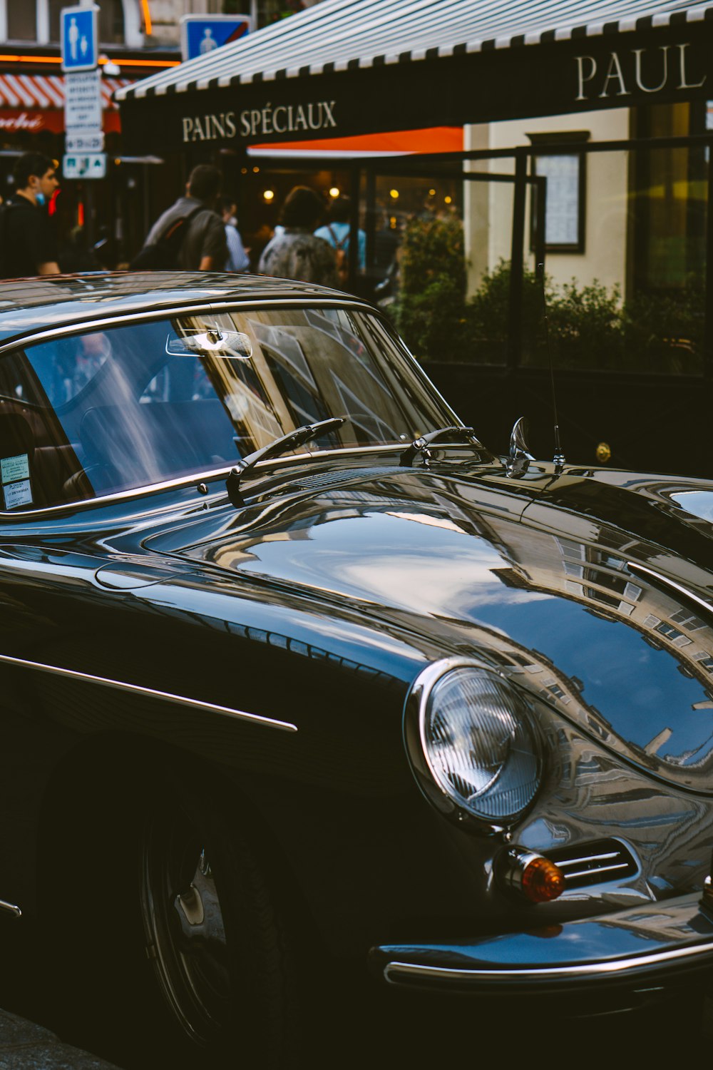 a black car parked on the side of the road