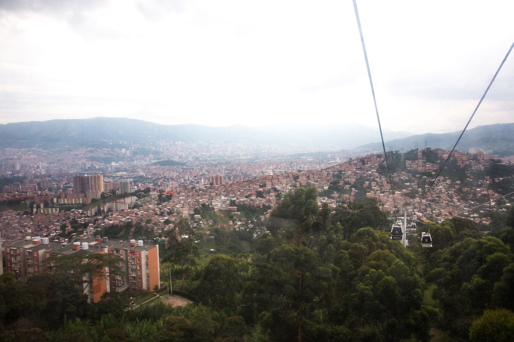 a view of a city from a cable car