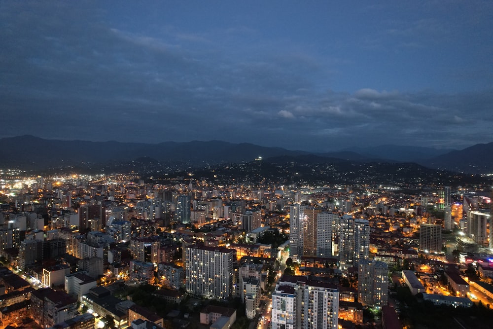 a view of a city at night from the top of a building