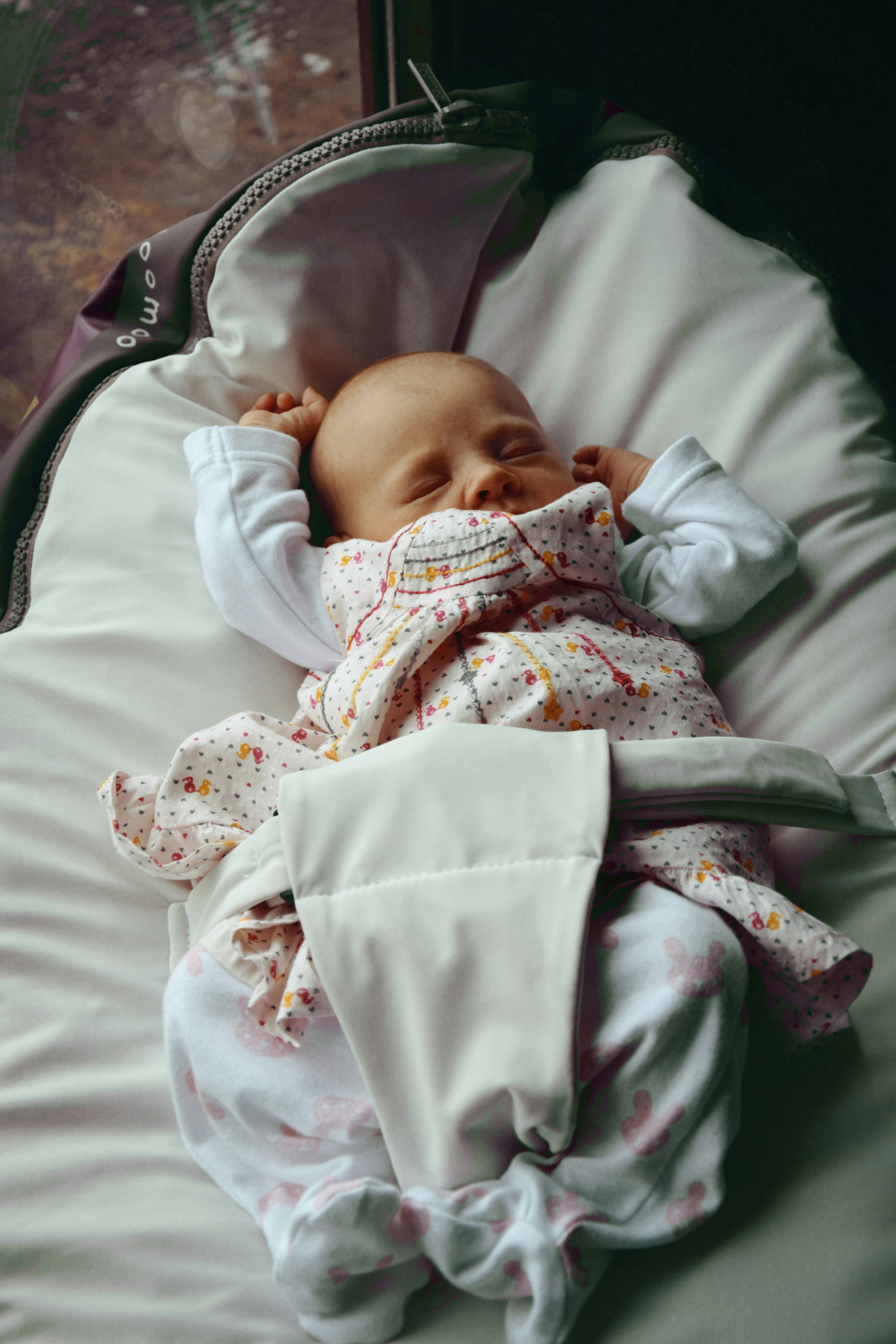 a baby is laying down in a crib