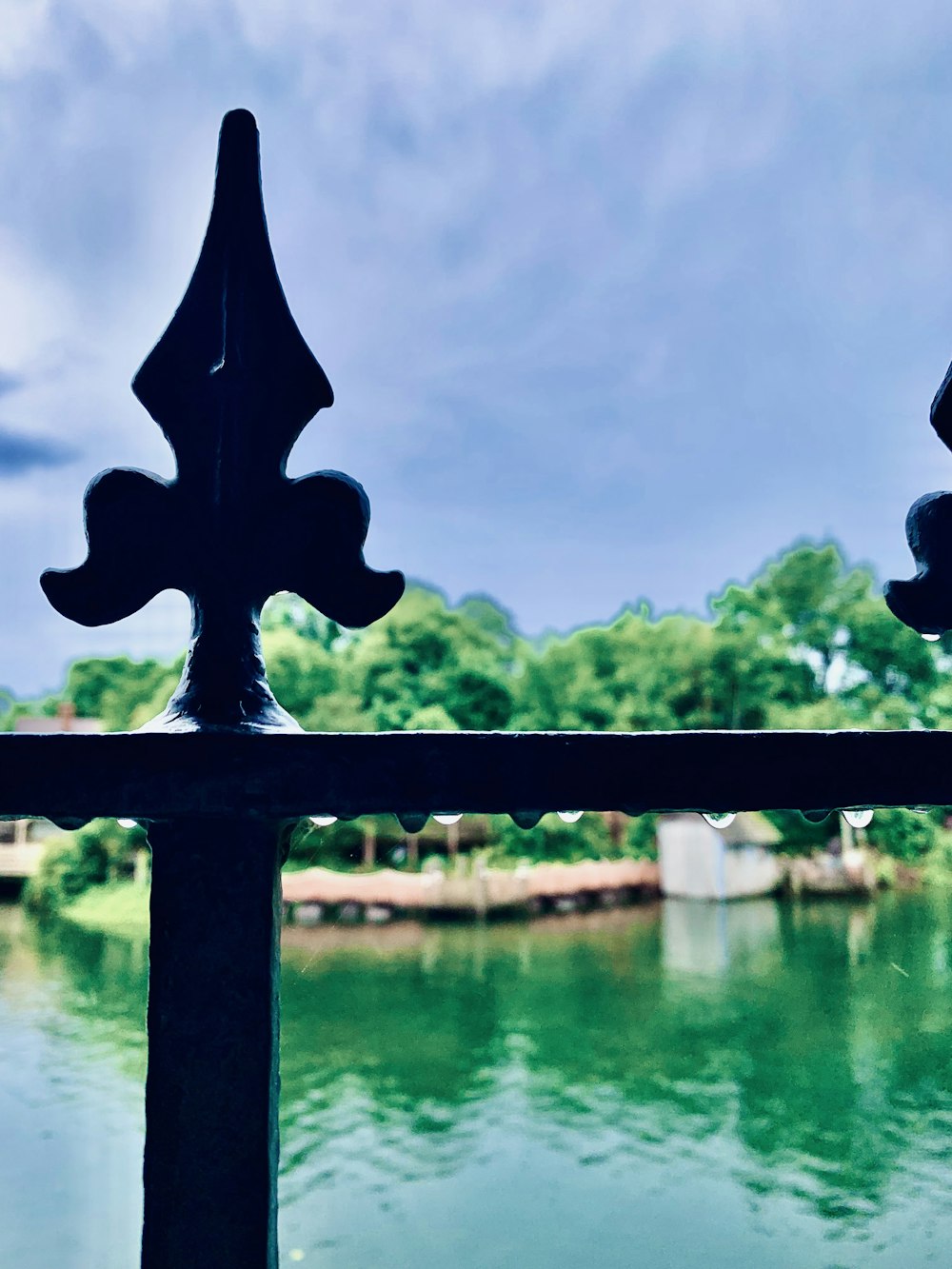 a view of a body of water from behind a fence