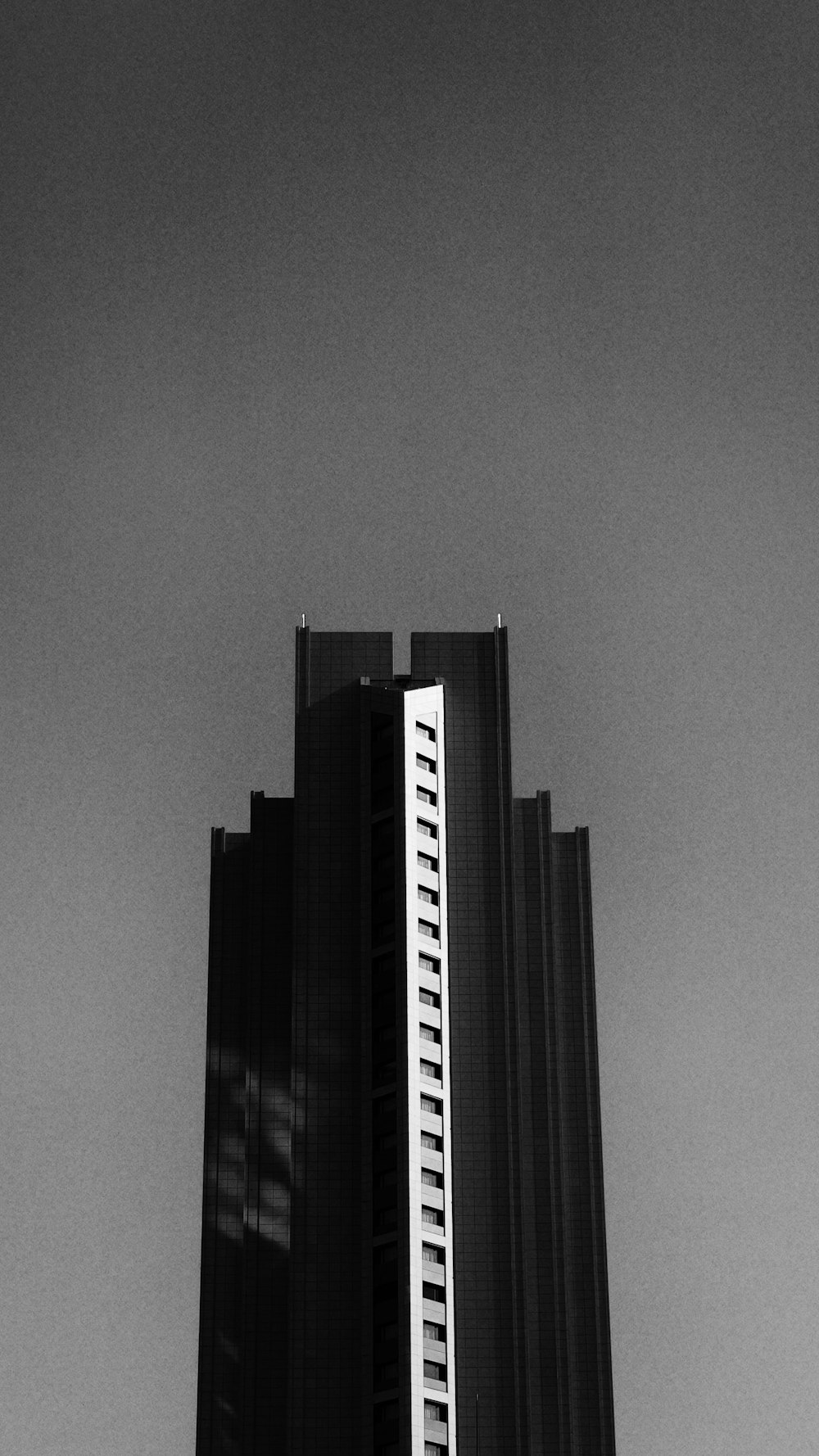 a black and white photo of a tall building