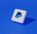 a white square with a blue p on it