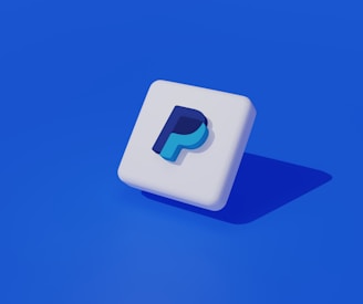 a white square with a blue p on it