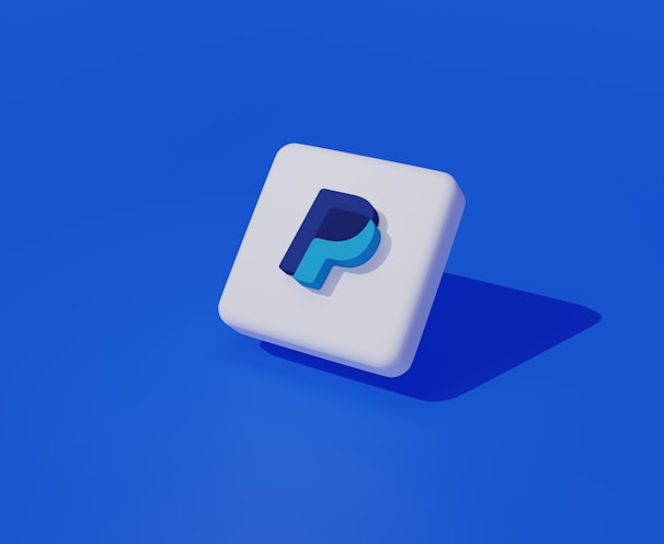 a white square with a blue p on it