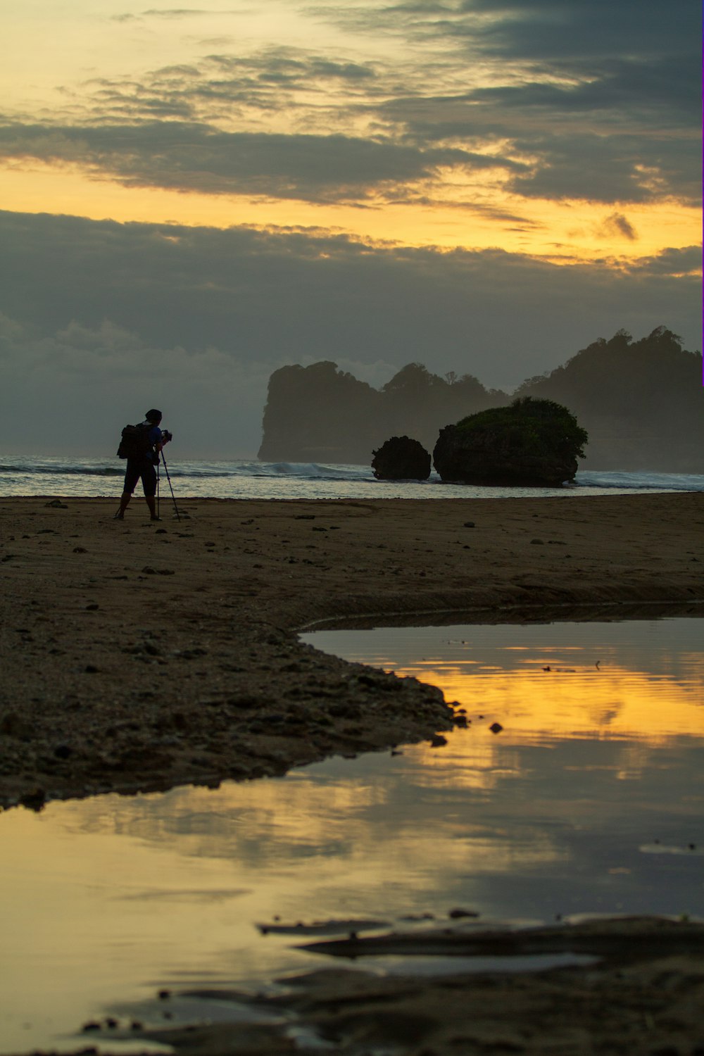 a person with a camera on a beach