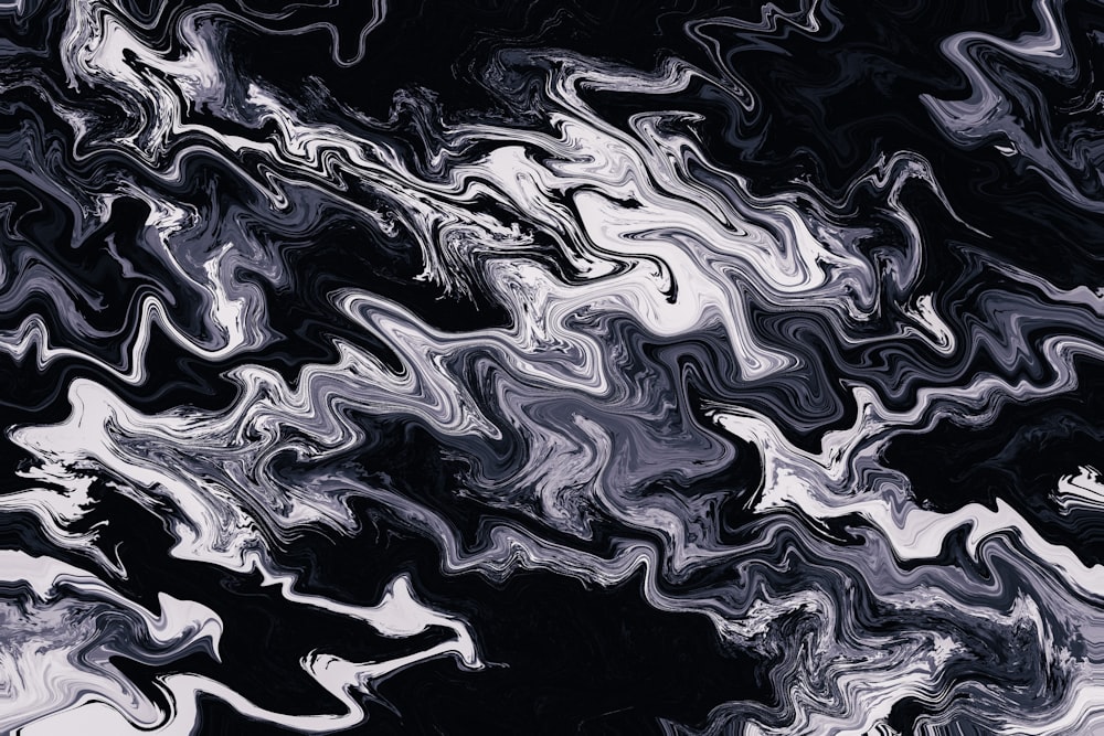 a black and white abstract painting with a black background