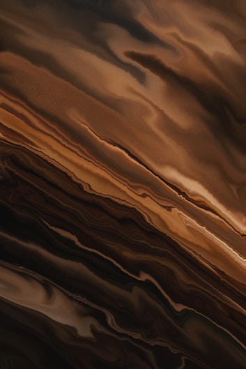 an abstract painting of a brown and black swirl