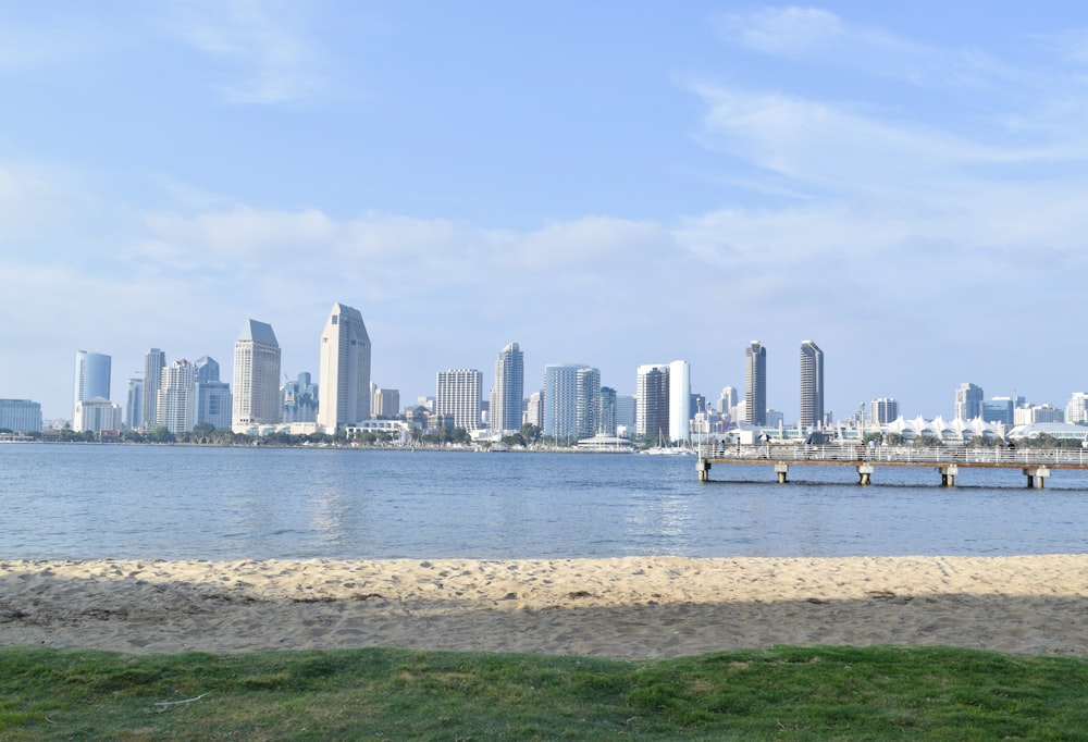 a body of water with a city in the background