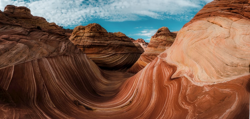 a rock formation in the desert under a blue sky