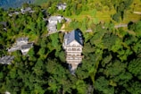 an aerial view of a building surrounded by trees