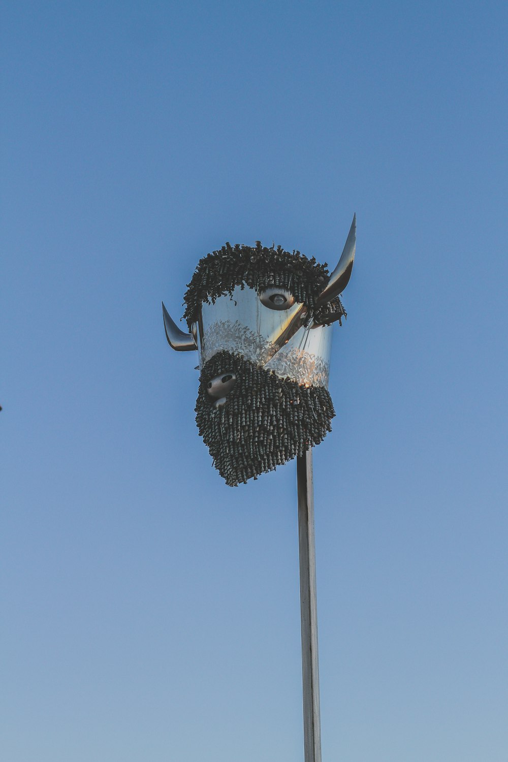 a sculpture of a man with a beard and mustache