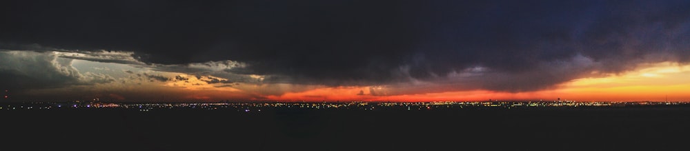 a very dark and cloudy sky over a city