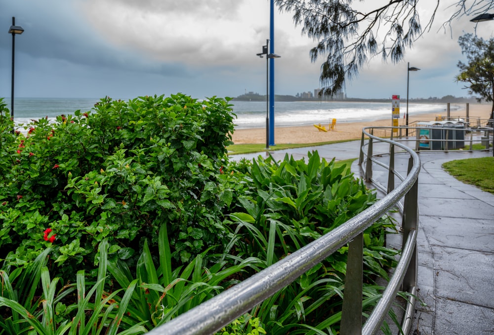 a walkway leading to a beach with a view of the ocean