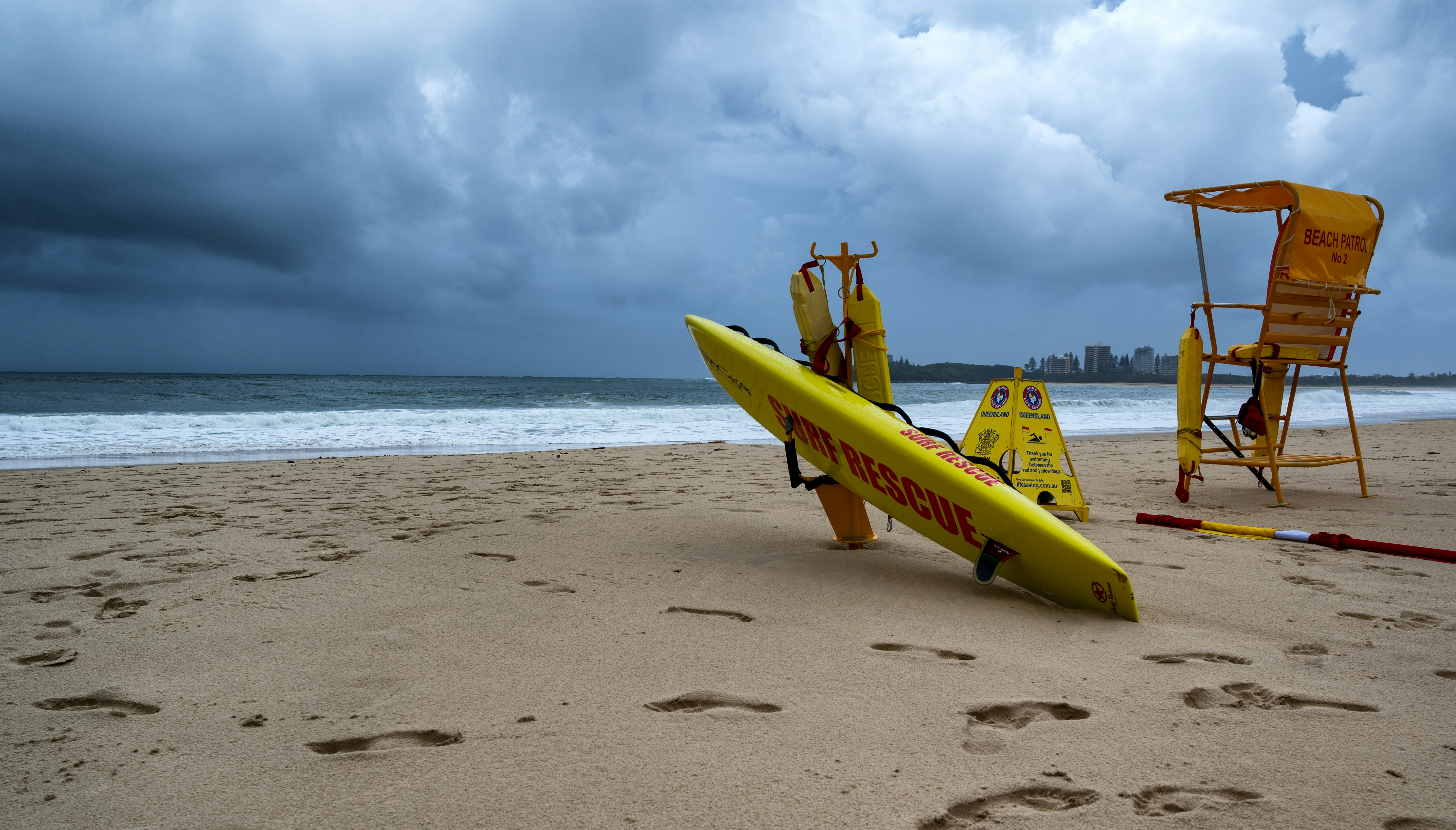 A yellow surfboard sitting on top of a sandy beach photo – Free Vehicle ...